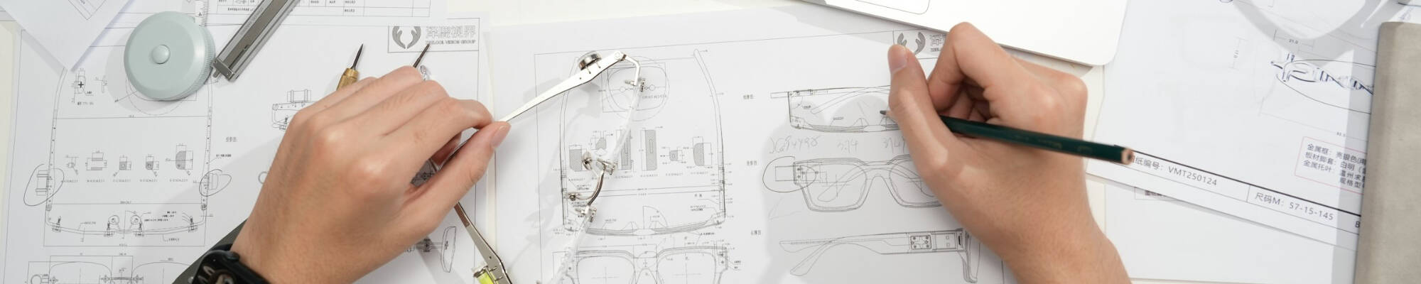 A person working on blueprints
